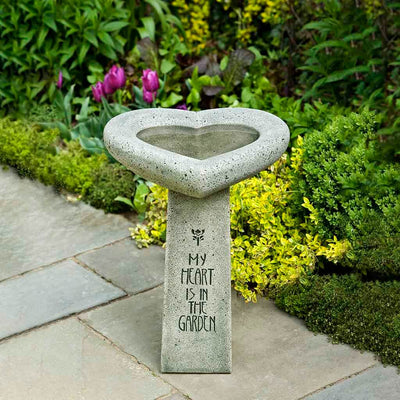 Campania International My Heart is in the Garden Birdbath, shown in the Alpine Stone color, highlighting and enriching the details of the cast stone.