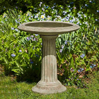 Campania International Cottage Garden Birdbath, set in the garden to adding charm and purpose. The birdbath is shown in the Verde Patina.