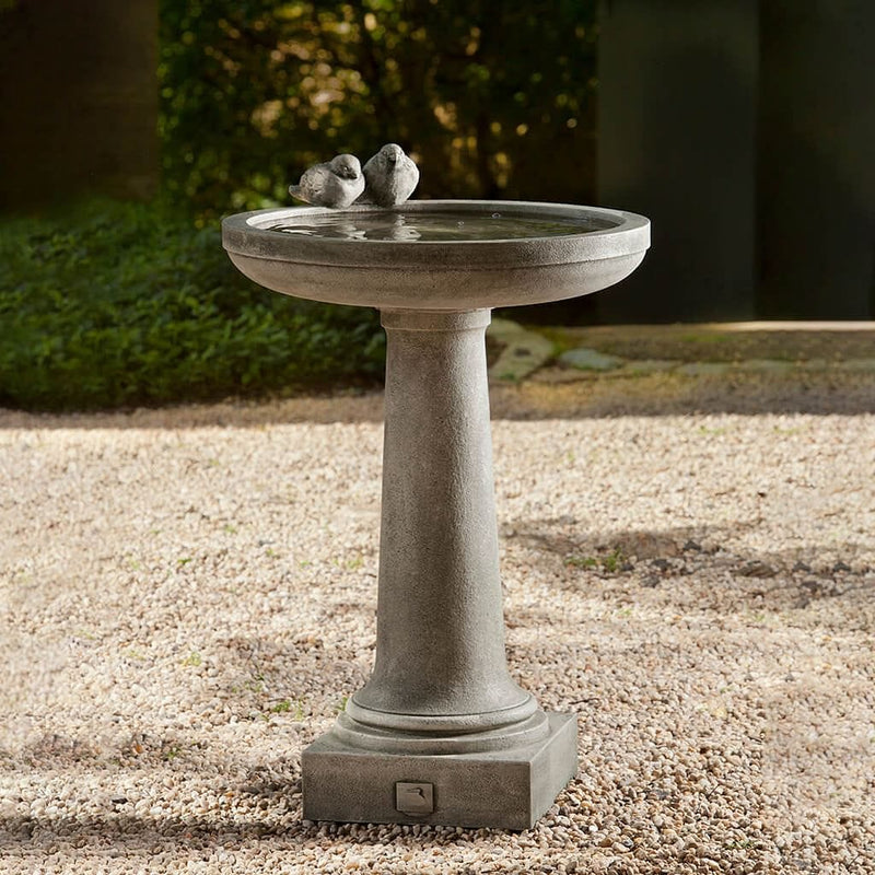 Campania International Juliet Birdbath, shown in the Alpine Stone color, highlighting and enriching the details of the cast stone.