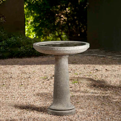 Campania International Isleboro Birdbath, shown in the Alpine Stone color, highlighting and enriching the details of the cast stone.