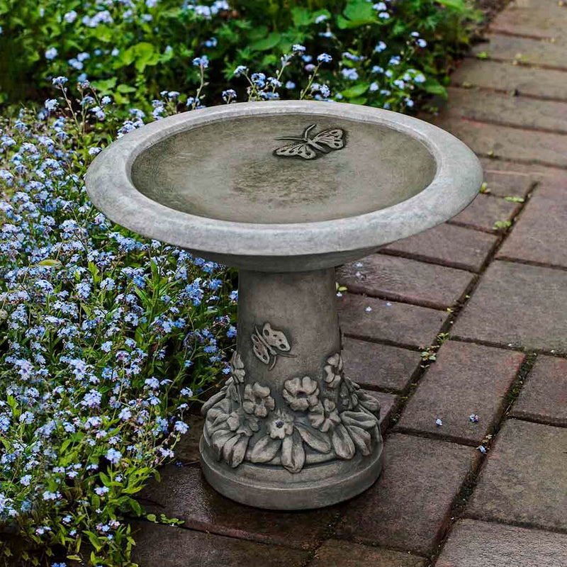 Campania International Spring Meadow Birdbath, shown in the Alpine Stone color, highlighting and enriching the details of the cast stone.