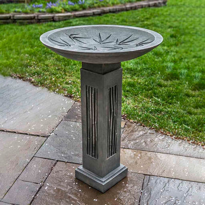 Campania International Sagano Birdbath, shown in the Alpine Stone color, highlighting and enriching the details of the cast stone.