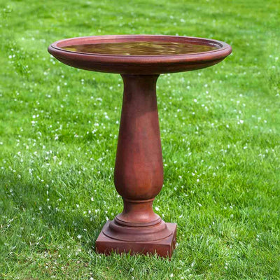 Campania International Westbury Birdbath, painted in the dramatic Ferro Rustico Nuovo, bringing a focal point to the landscape.