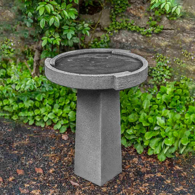 Campania International Small Concept Birdbath, shown in the Alpine Stone color, highlighting and enriching the details of the cast stone.