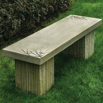 Campania International Sagano Bench, set in the garden to adding charm and purpose. The bench is shown in the English Moss Patina.