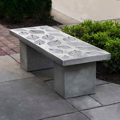 Campania International Hydrangea Leaf Bench, shown in the Alpine Stone color, highlighting and enriching the details of the cast stone.