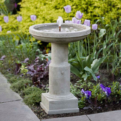 Campania International Powys Fountain is made of cast stone by Campania International and shown in the Greystone Patina