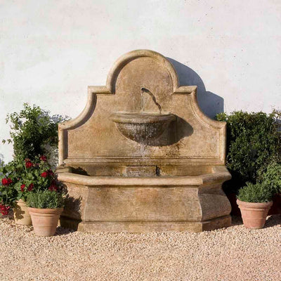Campania International Andalusia Wall Fountain, adding interest to the garden with the sound of water. This fountain is shown in the Aged Limestone Patina.