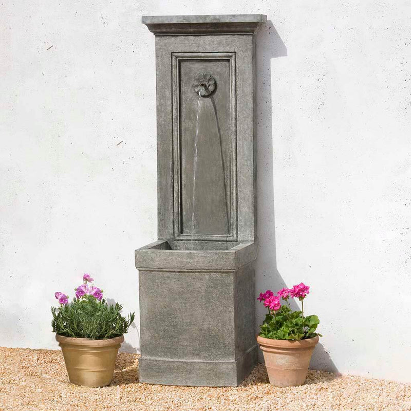 Campania International Auberge Wall Fountain, adding interest to the garden with the sound of water. This fountain is shown in the Alpine Stone Patina.