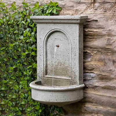 Campania International Portico Fountain, adding interest to the garden with the sound of water. This fountain is shown in the Alpine Stone Patina.