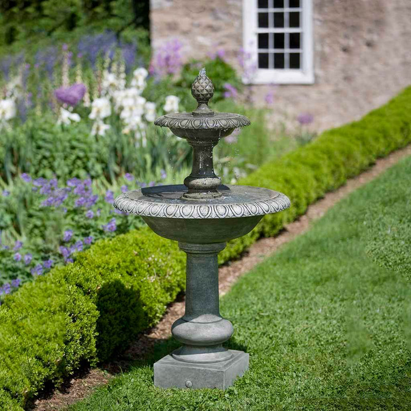 Campania International Williamsburg Pineapple 2 Tier Fountain, adding interest to the garden with the sound of water. This fountain is shown in the Alpine Stone Patina.