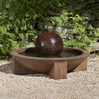 Campania International Low Zen Sphere Fountain, adding interest to the garden with the sound of water. This fountain is shown in the Pietra Nuova Patina.