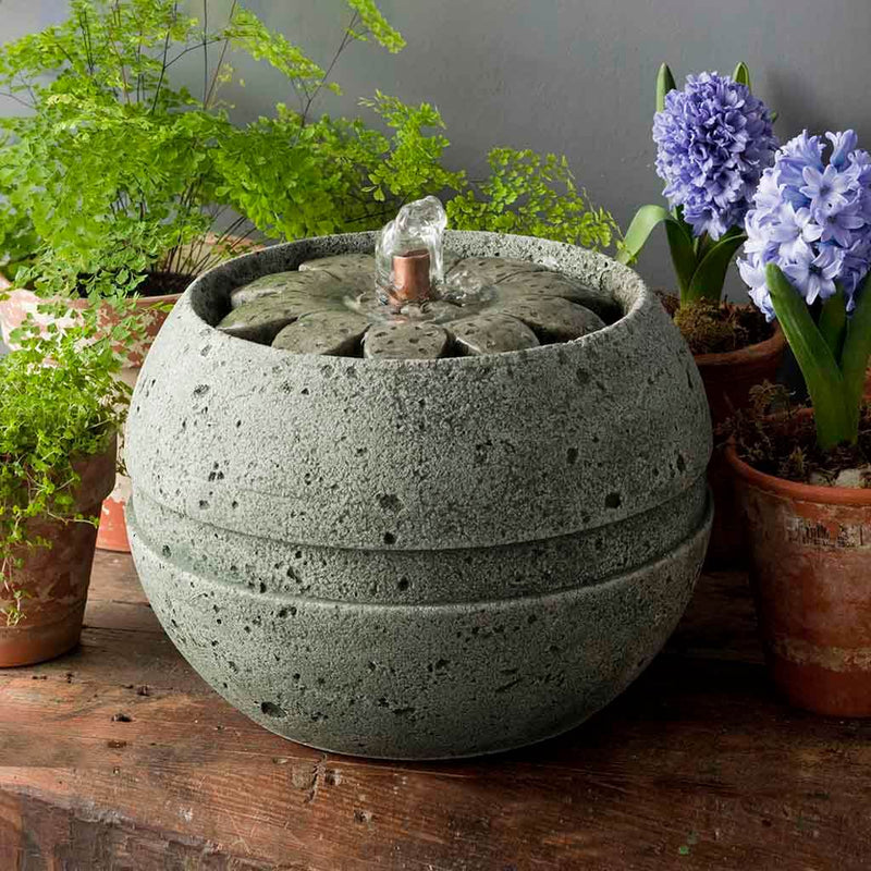 Campania International M-Series Rosette Fountain, adding interest to the garden with the sound of water. This fountain is shown in the Alpine Stone Patina.