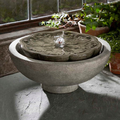 Campania International M-Series Flores Fountain, adding interest to the garden with the sound of water. This fountain is shown in the Alpine Stone Patina.
