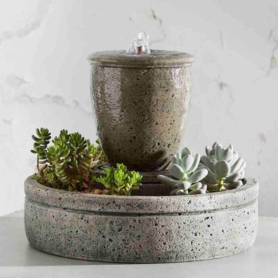 Campania International M-Series Rustic Spa Fountain with Planter, adding interest to the garden with the sound of water. This fountain is shown in the Alpine Stone Patina.