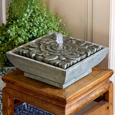Campania International M-Series Artifact Fountain, adding interest to the garden with the sound of water. This fountain is shown in the Alpine Stone Patina.