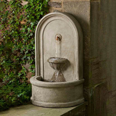 Campania International Colonna Fountain, adding interest to the garden with the sound of water. This fountain is shown in the Verde Patina.