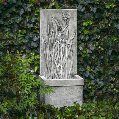 Campania International Dragonfly Wall Fountain, adding interest to the garden with the sound of water. This fountain is shown in the Alpine Stone Patina.