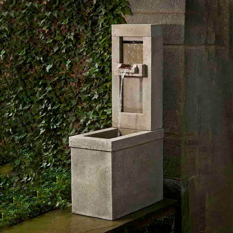 Campania International Lucas Fountain, adding interest to the garden with the sound of water. This fountain is shown in the Alpine Stone Patina.