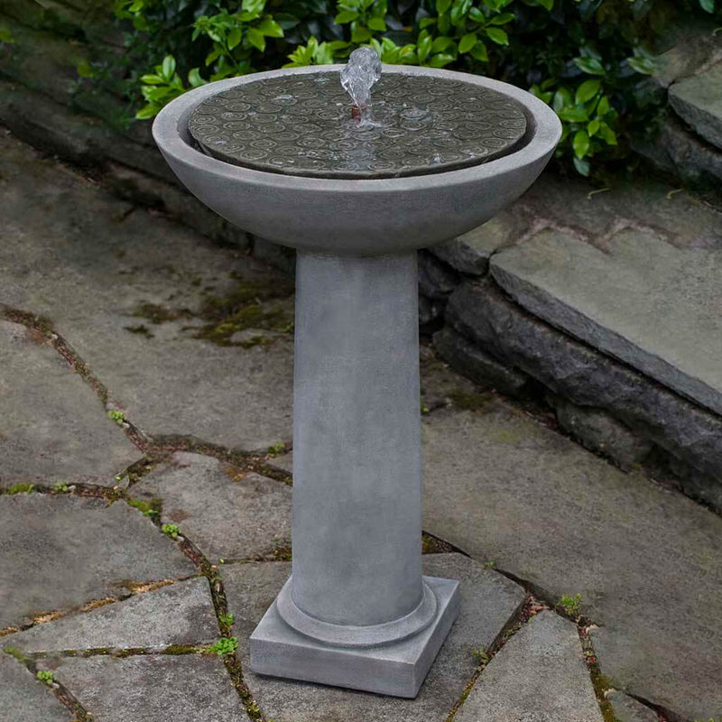 Campania International Cirrus Birdbath Fountain is made of cast stone by Campania International and shown in the Alpine Stone Patina