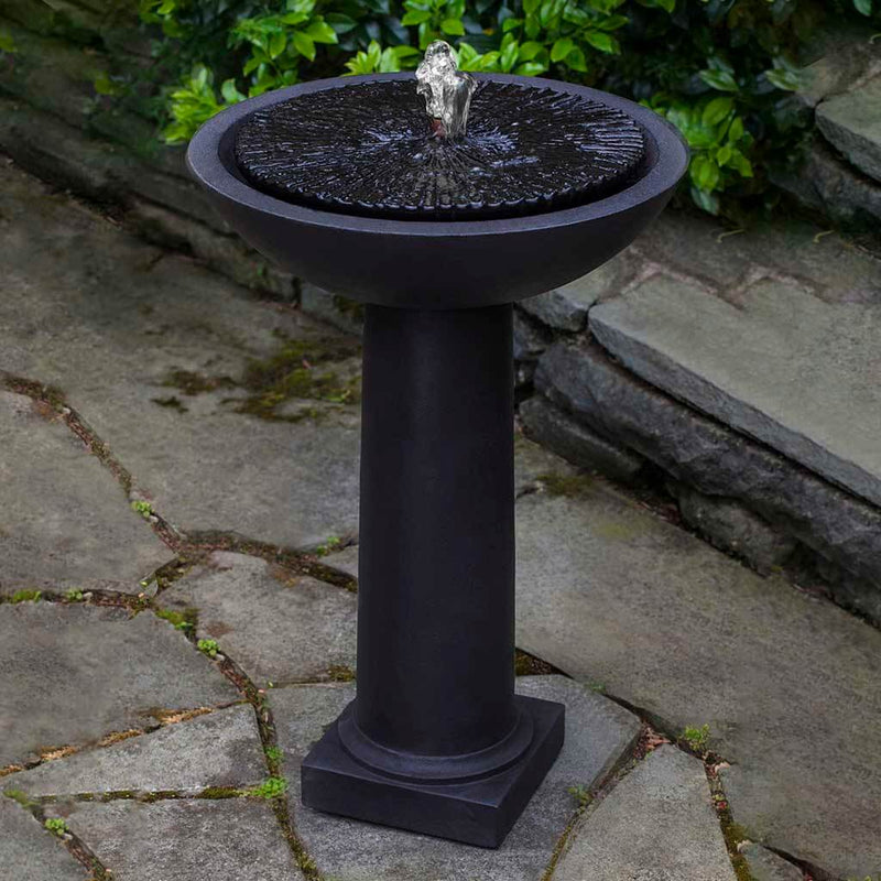 Campania International Equinox Birdbath Fountain is made of cast stone by Campania International and shown in the Nero Nuovo Patina