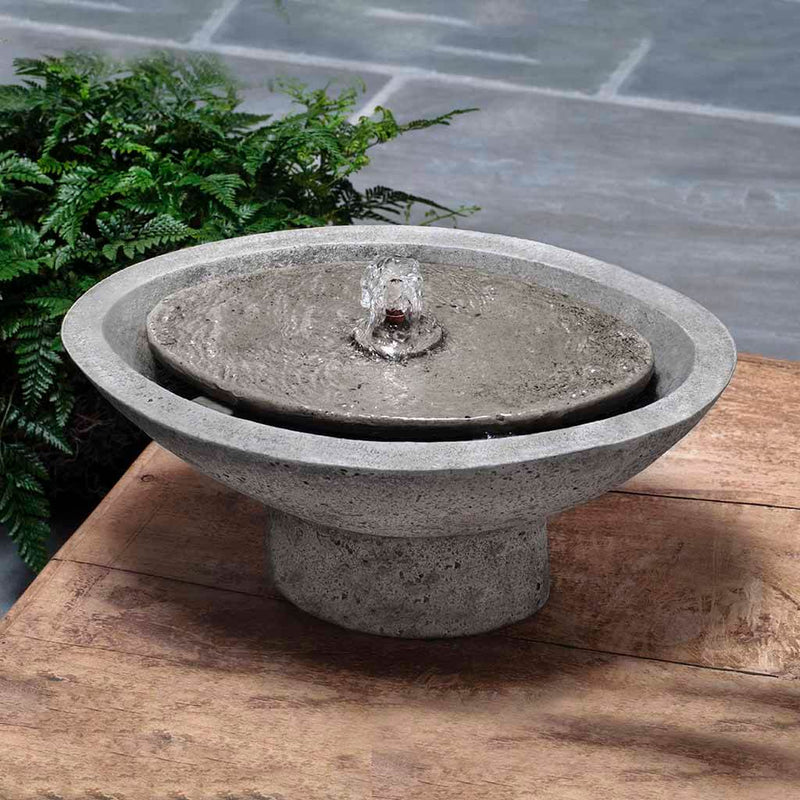 Campania International Zen Oval Fountain is made of cast stone by Campania International and shown in the Alpine Stone Patina