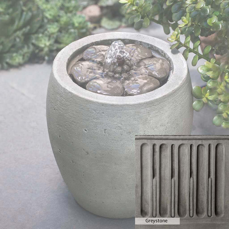 Greystone Patina for the Campania International M-Series Camellia Fountain, a classic gray, soft, and muted, blends nicely in the garden.