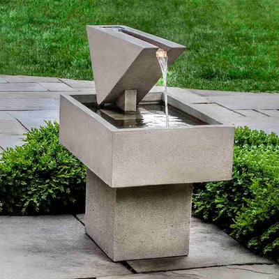 Campania International Triad Fountain is made of cast stone by Campania International and shown in the Greystone Patina