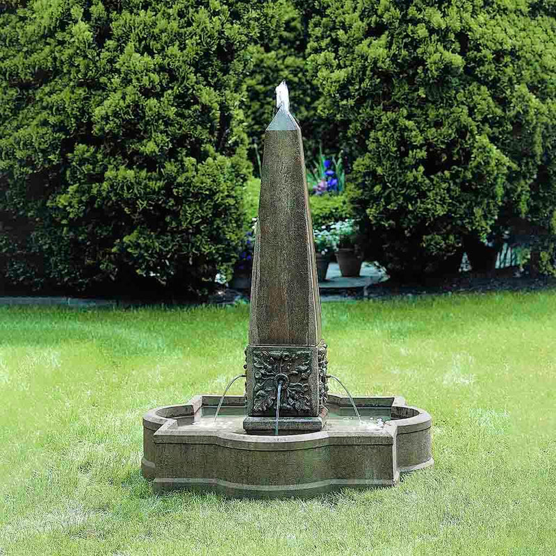 Campania International Palazzo Obelisk Fountain, adding interest to the garden with the sound of water. This fountain is shown in the Aged Limestone Patina.