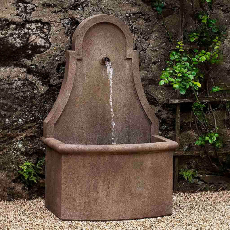 Campania International Closerie Wall Fountain, adding interest to the garden with the sound of water. This fountain is shown in the Alpine Stone Patina.