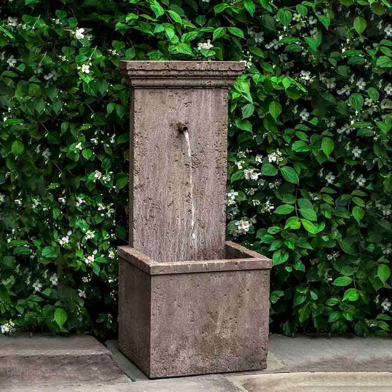 Campania International Marais Wall Fountain, adding interest to the garden with the sound of water. This fountain is shown in the Aged Limestone Patina.