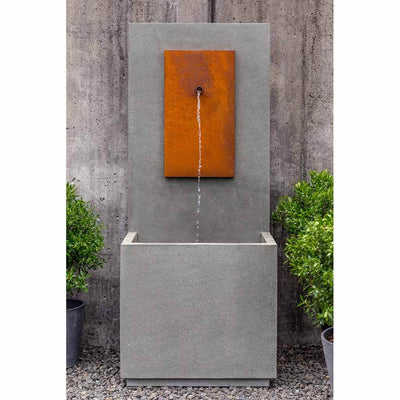 Campania International MC1 Fountain with Corten Steel Face, adding interest to the garden with the sound of water. This fountain is shown in the Alpine Stone Patina.