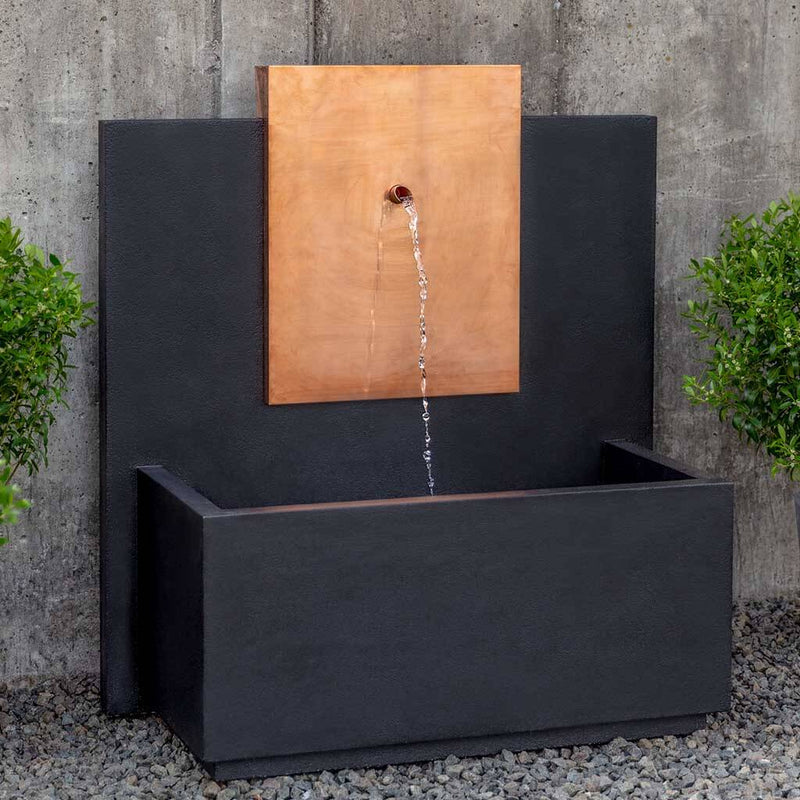 Campania International MC3 Fountain with Copper Face, adding interest to the garden with the sound of water. This fountain is shown in the Nero Nuovo Patina.