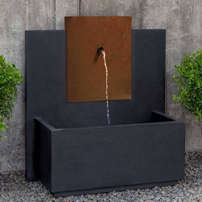 Campania International MC3 Fountain with Corten Steel Face, adding interest to the garden with the sound of water. This fountain is shown in the Nero Nuovo Patina.