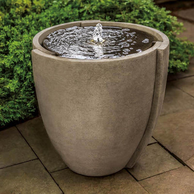 Campania International Concept Basin Fountain, adding interest to the garden with the sound of water. This fountain is shown in the Greystone Patina.
