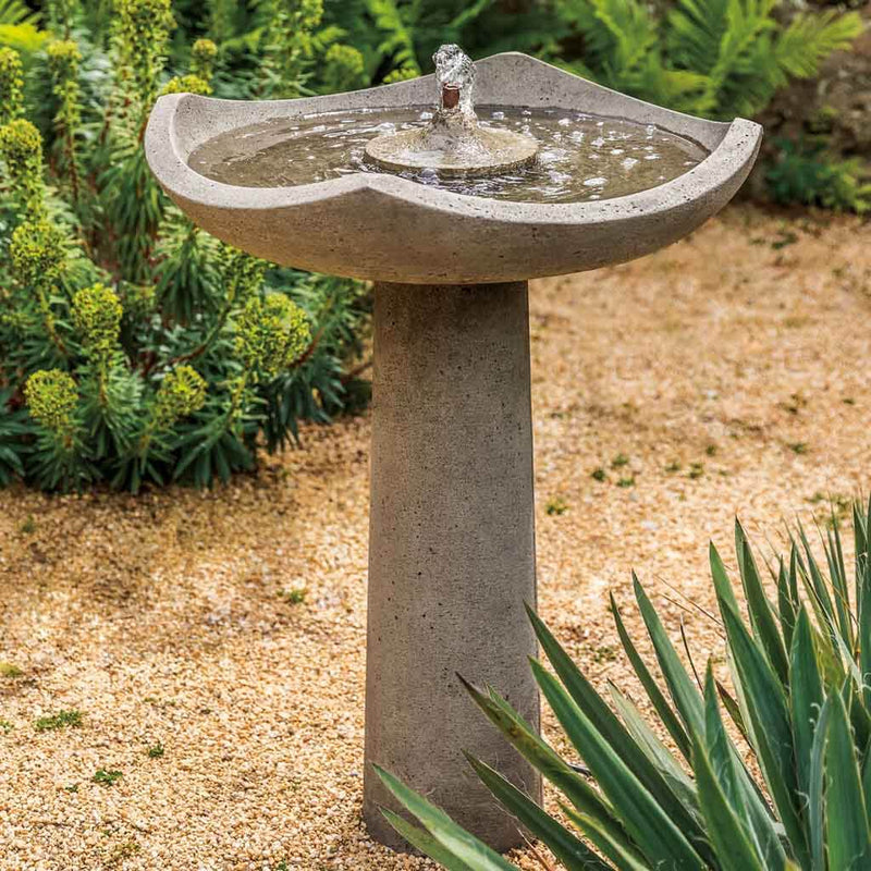 Campania International Oslo Fountain, adding interest to the garden with the sound of water. This fountain is shown in the Greystone Patina.