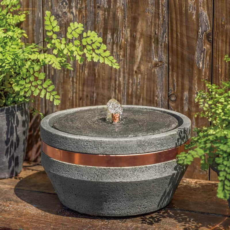 Campania International M-Series Bevel Fountain, adding interest to the garden with the sound of water. This fountain is shown in the Alpine Stone Patina.