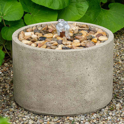 Campania International Salinas Pebble Fountain is made of cast stone by Campania International and shown in the Greystone Patina