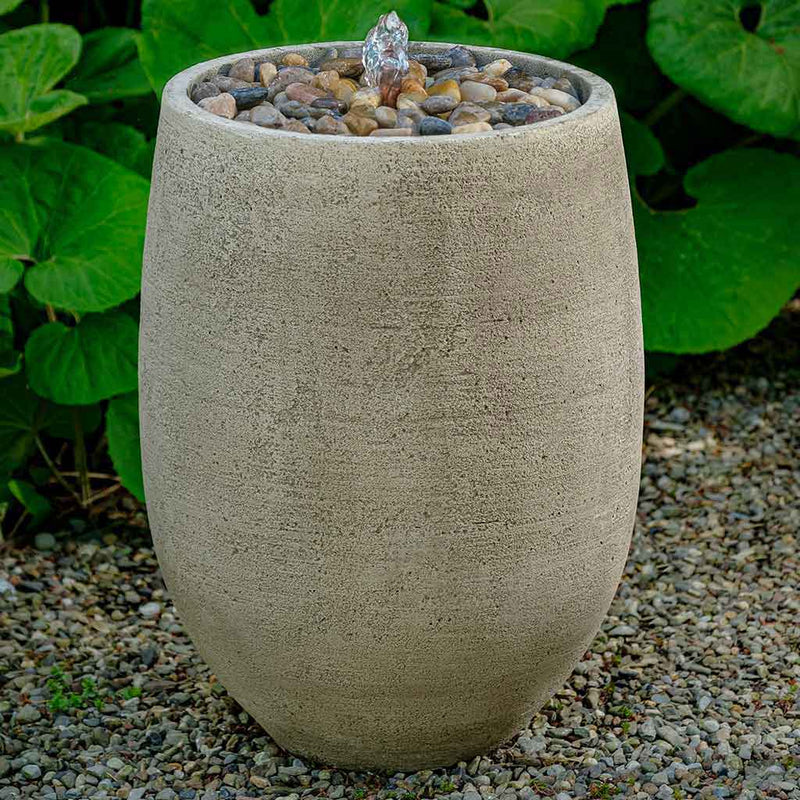 Campania International Bebel Pebble Tall Fountain  is made of cast stone by Campania International and shown in the  Greystone Patina