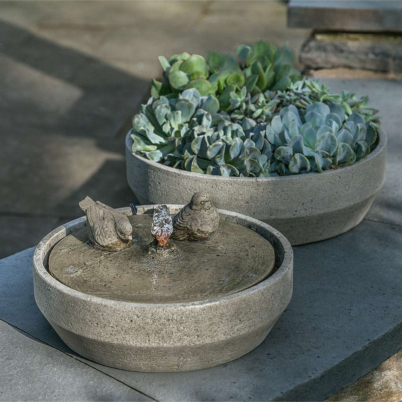 Campania International Beveled Songbird Fountain is made of cast stone by Campania International and shown in the Greystone Patina