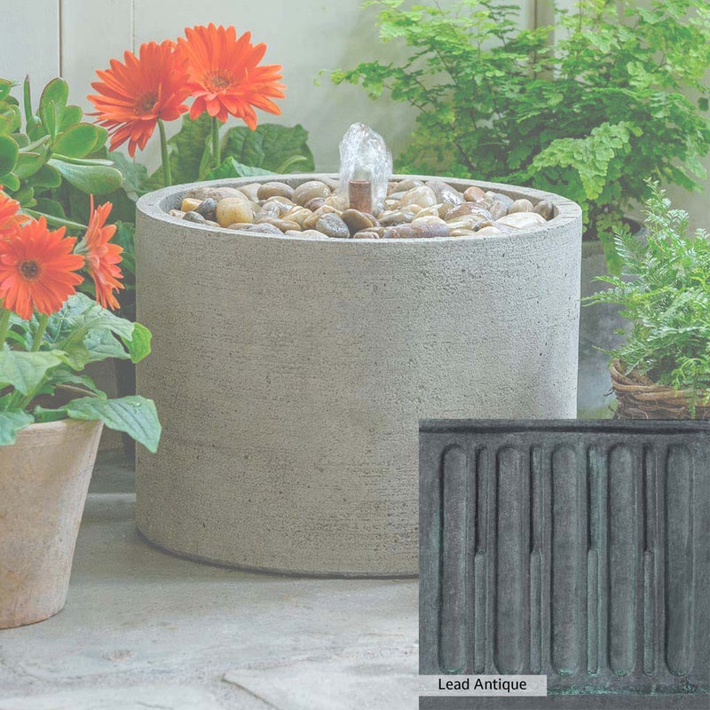 Lead Antique Patina for the Campania International Salinas Low Pebble Fountain, deep blues and greens blended with grays for an old-world garden.