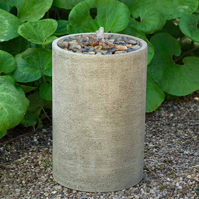 Campania International Salinas Pebble Tall Fountain is made of cast stone by Campania International and shown in the Greystone Patina