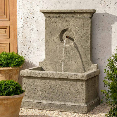 Campania International Arles Fountain, adding interest to the garden with the sound of water. This fountain is shown in the Alpine Stone Patina.