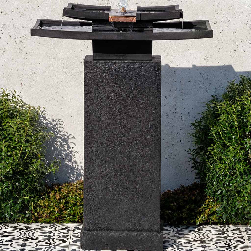 Campania International Katsura Fountain with Pedestal, adding interest to the garden with the sound of water. This fountain is shown in the Nero Nuovo Patina.