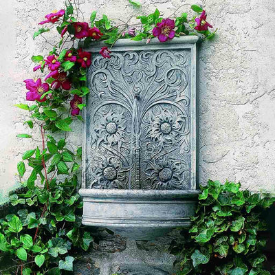 Campania International Sussex Wall Fountain, adding interest to the garden with the sound of water. This fountain is shown in the Alpine Stone Patina.