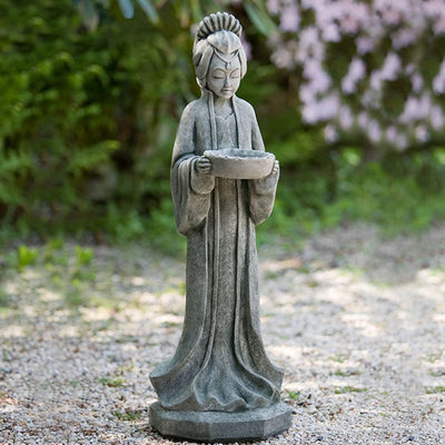 Campania International Nobility Statue, set in the garden to adding charm an meaning. The statue is shown in the Alpine Stone Patina.
