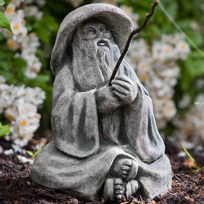 Campania International Hiroki Statue, set in the garden to adding charm an meaning. The statue is shown in the Alpine Stone Patina.