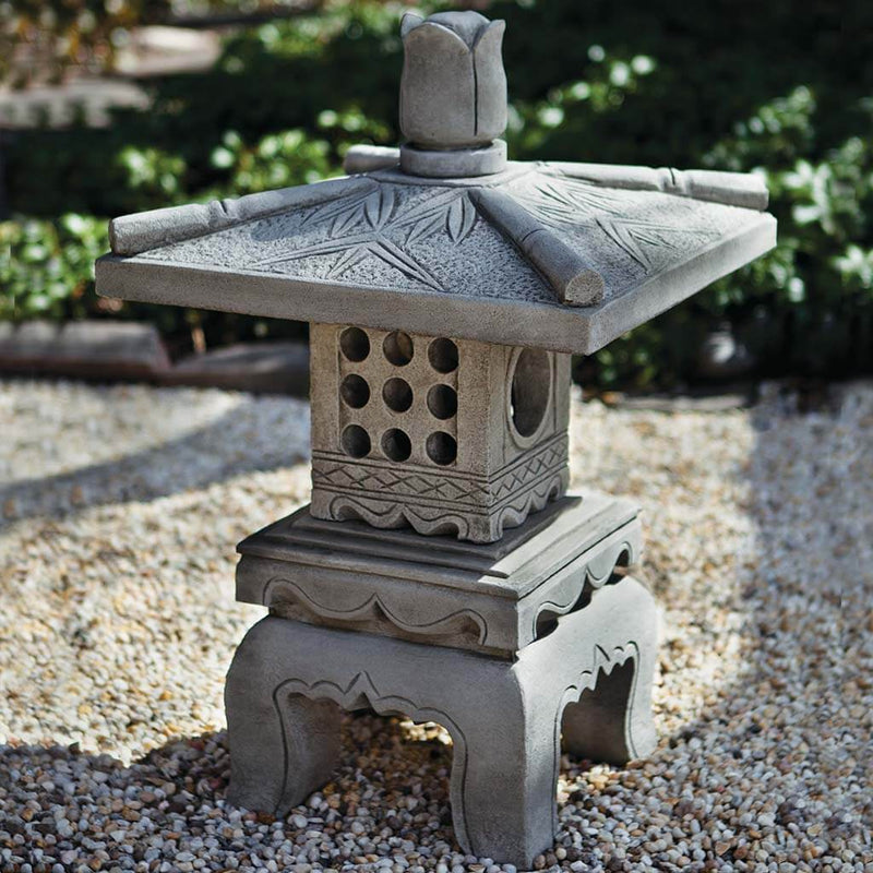 Campania International Bamboo Pagoda, set in the garden to adding charm an meaning. The statue is shown in the Greystone Patina.