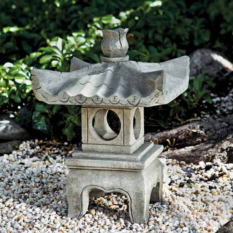 Campania International Antique Pagoda, set in the garden to adding charm an meaning. The statue is shown in the Greystone Patina.