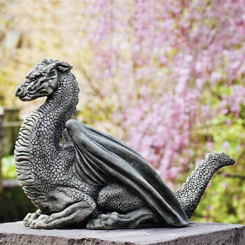 Campania International Pelath Statue, set in the garden to adding charm an meaning. The statue is shown in the Alpine Stone Patina.